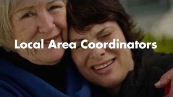 Two ladies hugging with Local Area Coordinators written across the screen