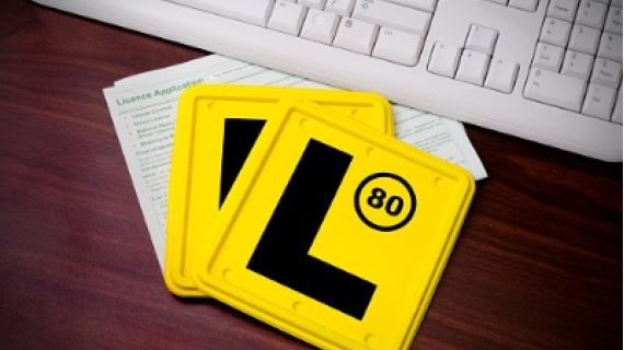 Two yellow "L" learner plates