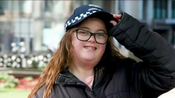 Young lady wearing a police hat