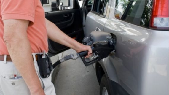 Senior man getting fuel