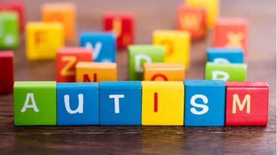 Colourful alphabet blocks which spell out "autism".