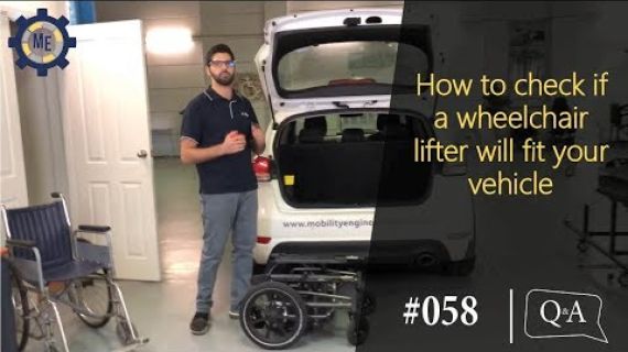 Man standing at the back of a car with the car boot open
