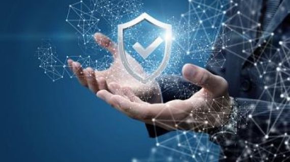 hands holding a a tick and shield symbol