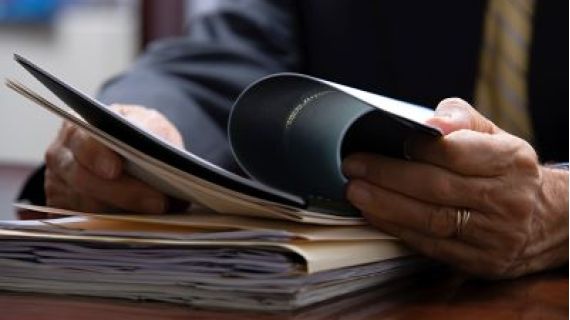 A person looking through files.
