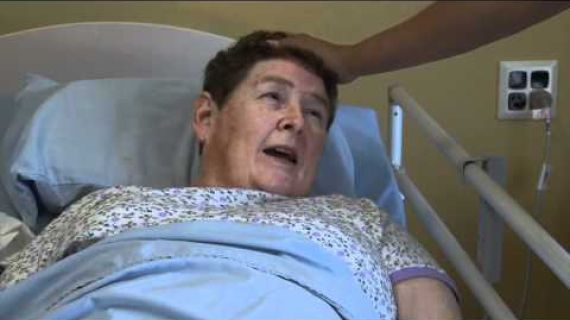 Lady laying in a hospital bed