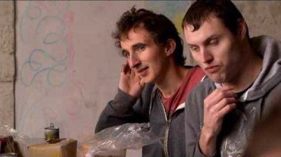 Two men sitting and talking