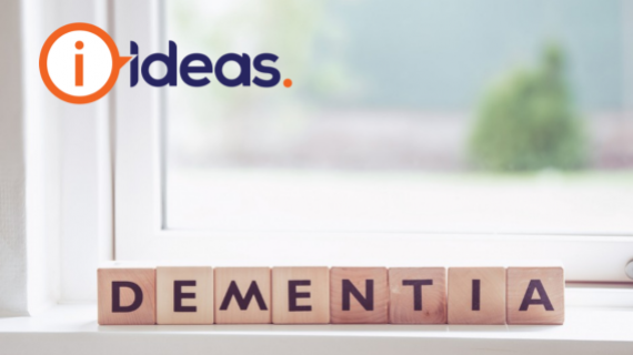 Image of the word dementia spelled out by wooden blocks with letters on them. The blocks are positioned on a window sill.