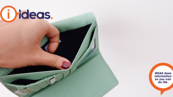 A woman opens an aqua coloured purse, it is empty.