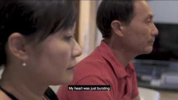 Cecilia sitting on the lounge with her husband watching dancing with the stars