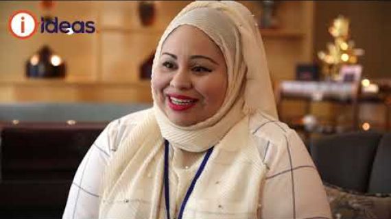 Lady sitting on a chair speaking