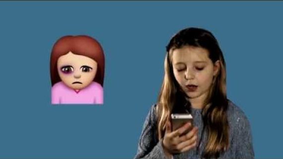 Young girl with mobile phone in her hand and a sad emoji next to her