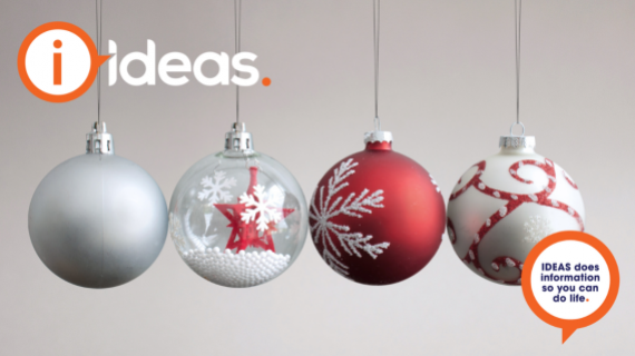 A group of 4 Christmas Baubles balanced together.