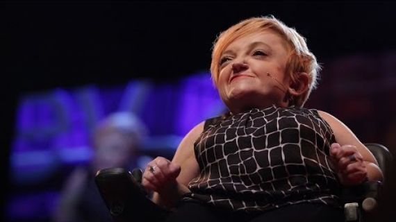 Stella Young on stage in her wheelchair