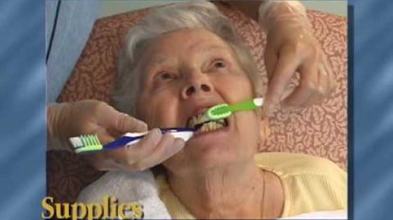 Lady having her teeth brushed