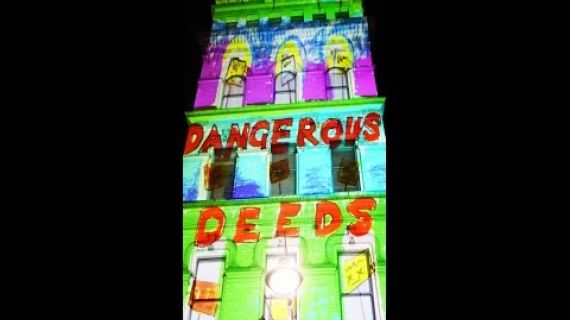 Building lit up with art