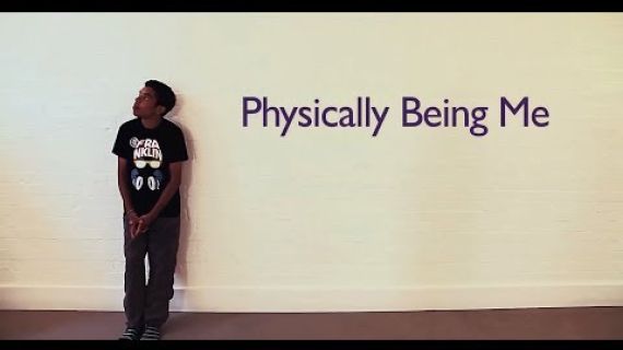 Young man leaning against a wall