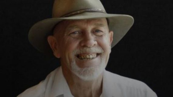 Man with a hat on smiling