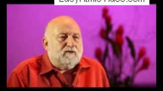 Man sitting with pink background