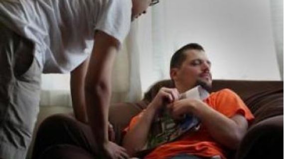 Image of a man sitting on a couch