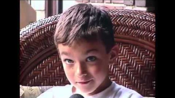 Young boy sitting in a chair