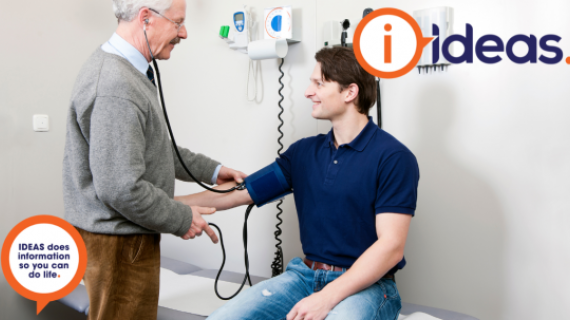 A doctor checks the blood pressure of a patient.