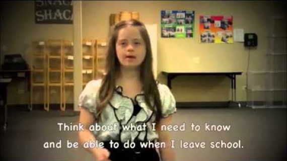 Young girl standing in her classroom