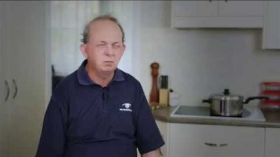 Man sitting in kitchen