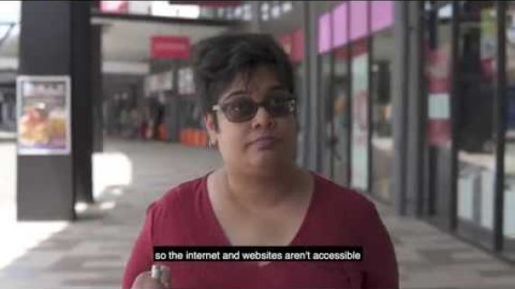 Picture of Nidhi walking up the street near the shops on the sidewalk