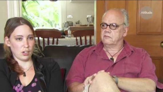 Father and daughter sitting on the lounge