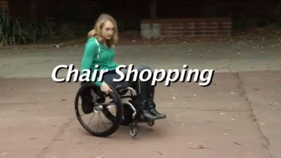 Lady on sidewalk in wheelchair