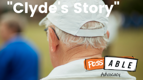 The back of a man's head. He wears glasses, has white hair, and is wearing a white hat,