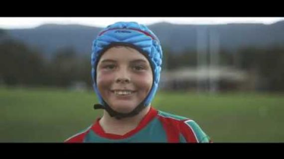 Young boy with a football helmet on