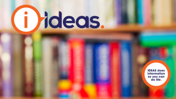 Photography of a deliberately blurred bookshelf, and books, representing low vision.