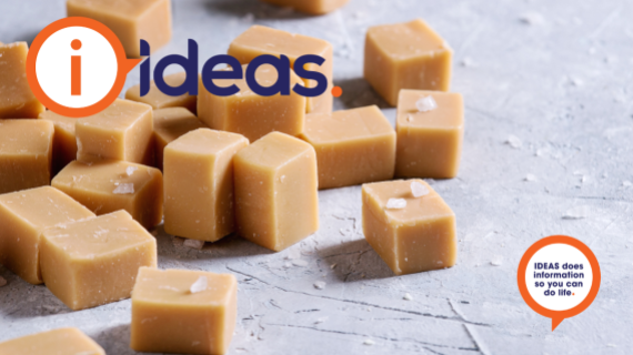 Squares of caramel coloured fudge with sea salt flakes.
