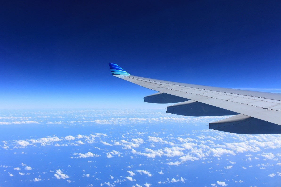 Aeroplane Wing Flying in the Clouds